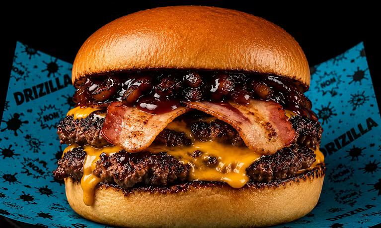 Destroy Your Cravings Burger. American cheese, turkey bacon, Korean BBQ sauce, lettuce and crispy onions.
