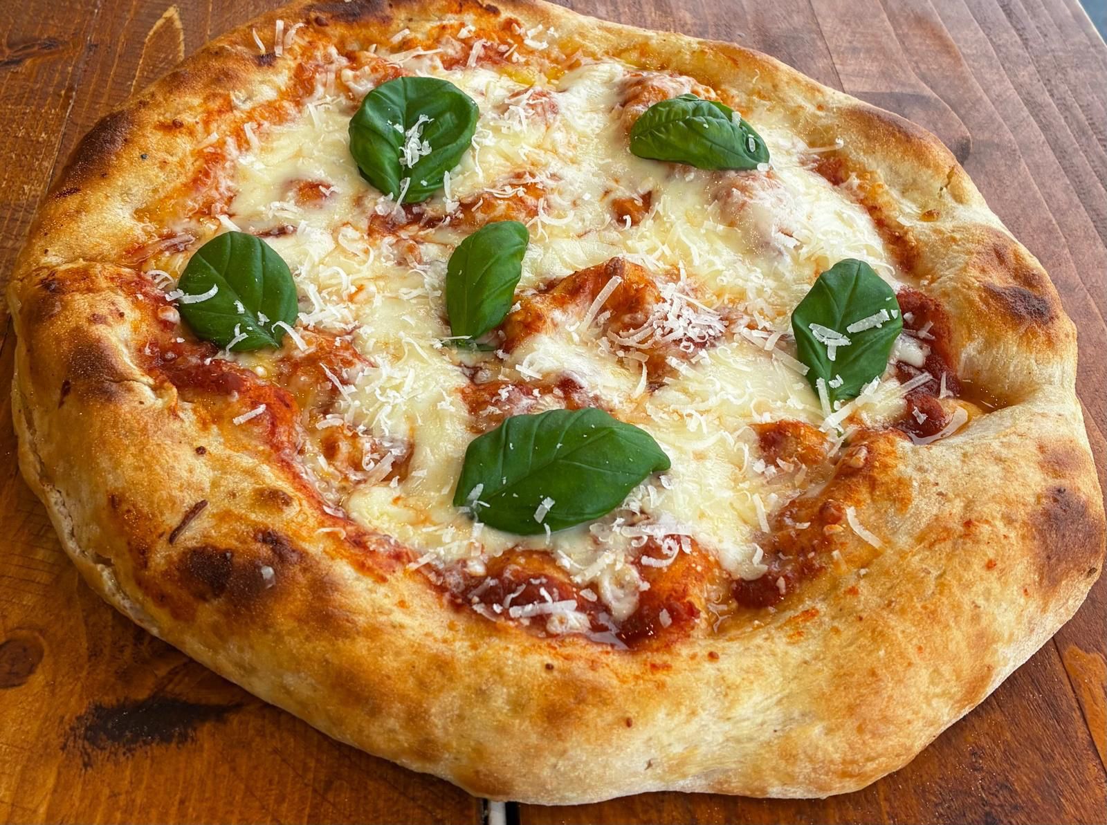 MOZZA MIA: House tomato sauce, fior dilate mozzarella, fresh basil, parmigiano reggiano