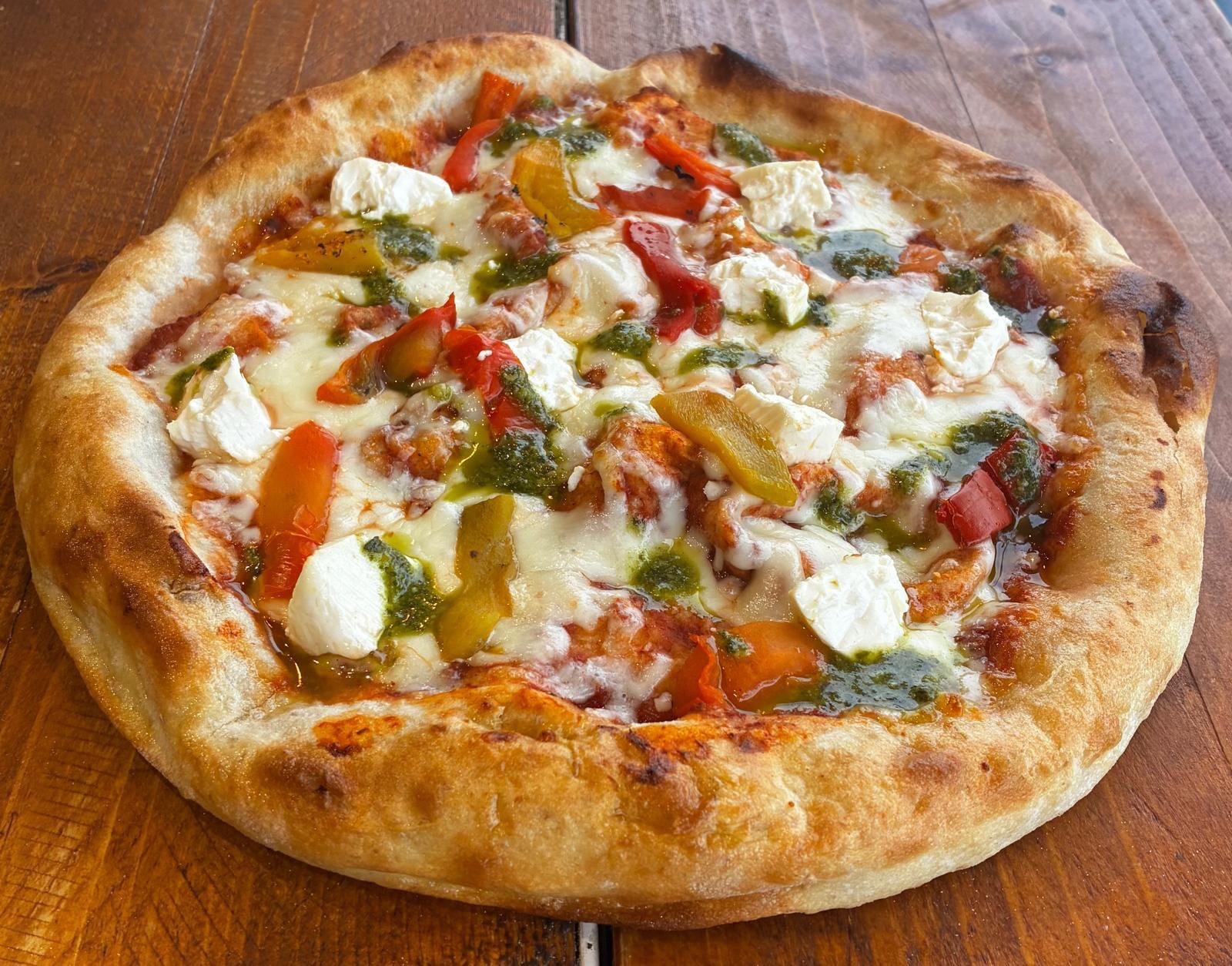 PRIMAVERA:  House tomato sauce, fior dilate mozzarella, roasted peppers, feta cheese, pesto genovese