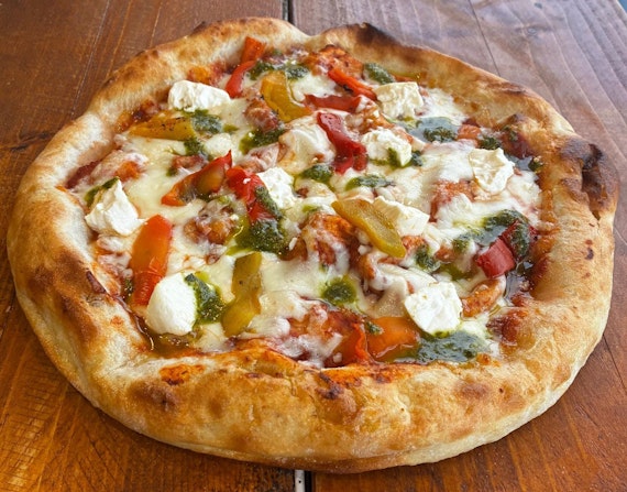 PRIMAVERA:  House tomato sauce, fior dilate mozzarella, roasted peppers, feta cheese, pesto genovese