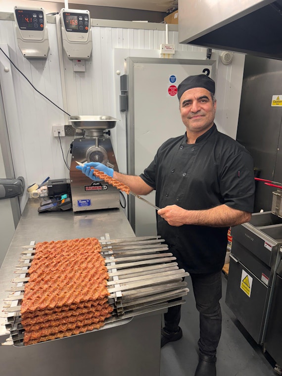 Shish being prepared by the restaurant owner